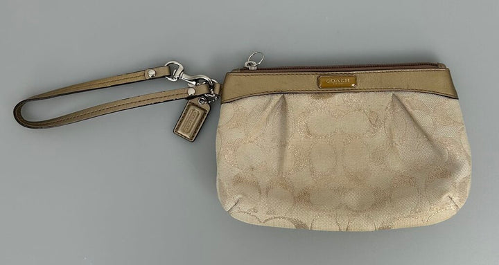 Coach bronze/gold fabric wristlet