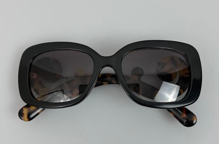 Prada swirly tortoiseshell sunglasses